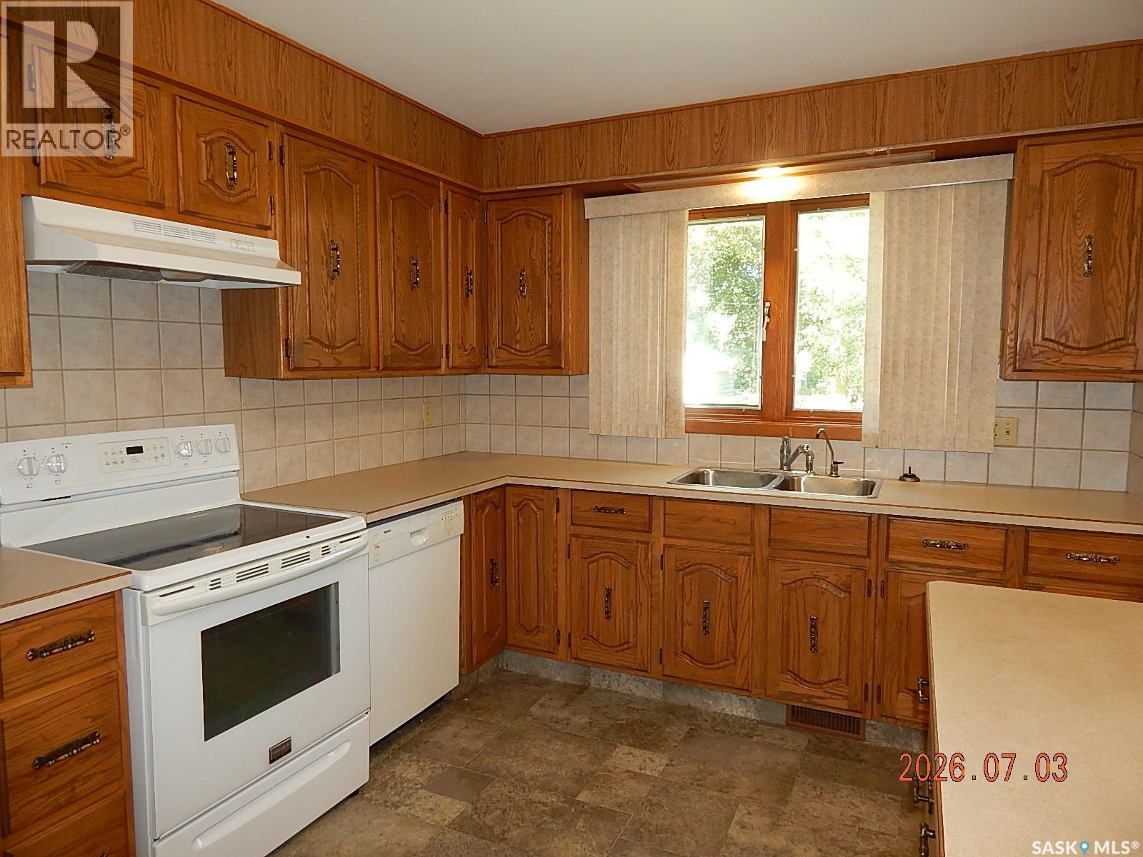 710 3Rd Street E, Assiniboia, SK - Indoor Photo Showing Kitchen With Double Sink