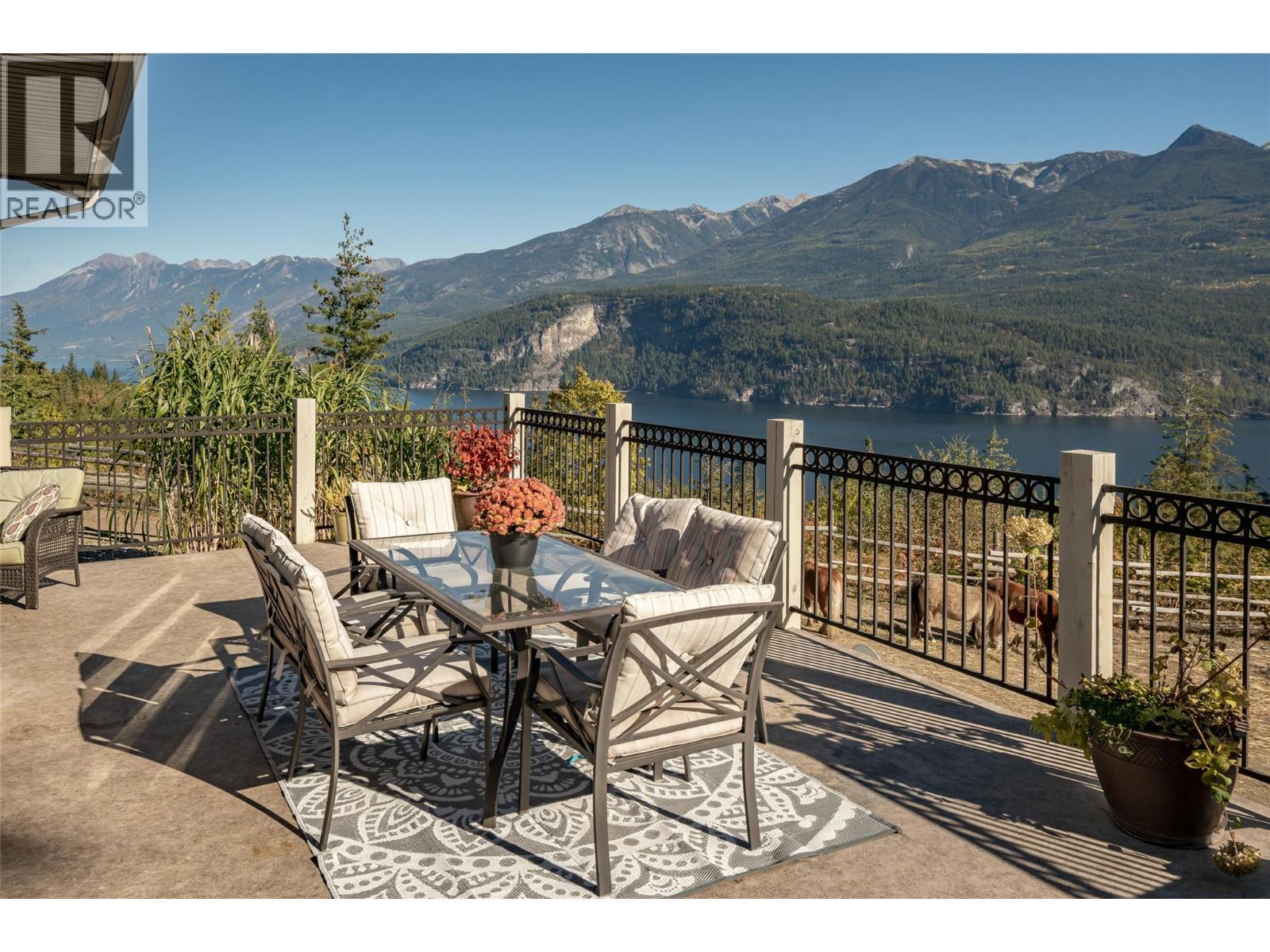 8840 Olson Road, Kaslo, BC - Outdoor With Body Of Water With Deck Patio Veranda With View