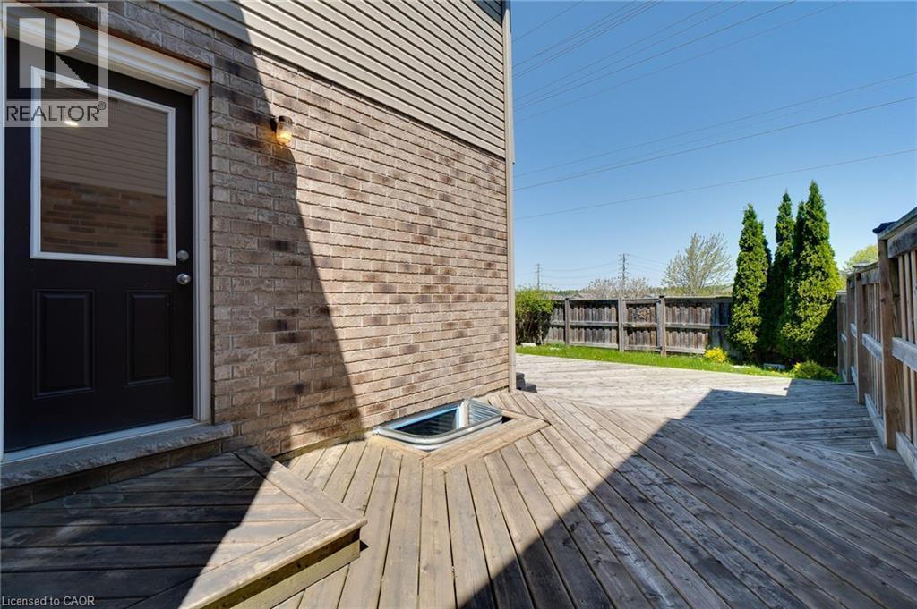 Expansive wood deck with geometric plank pattern - 928 Dunblane Court, Kitchener, ON