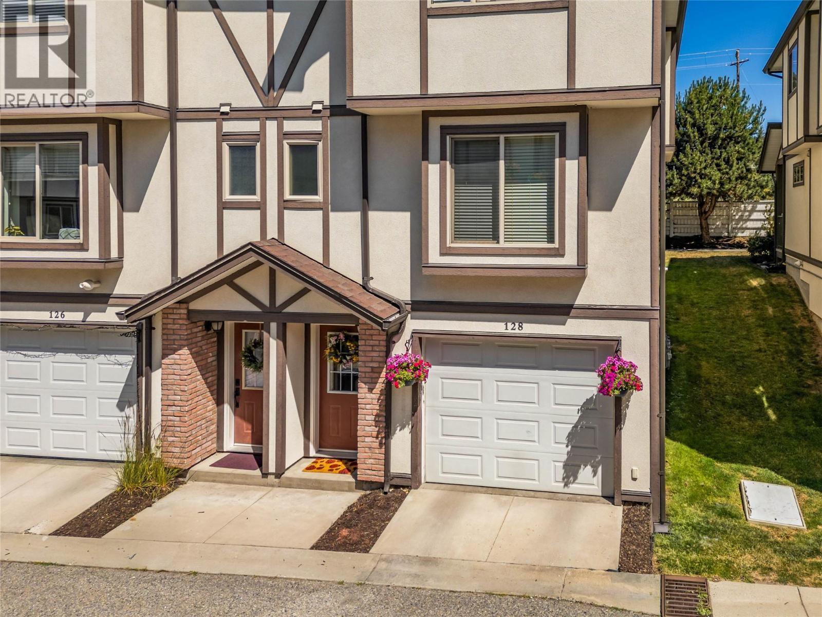 End unit so only 1 common wall and the garage is 1' wider than many in the complex. - 128-1651 Lynrick Road, Kelowna, BC