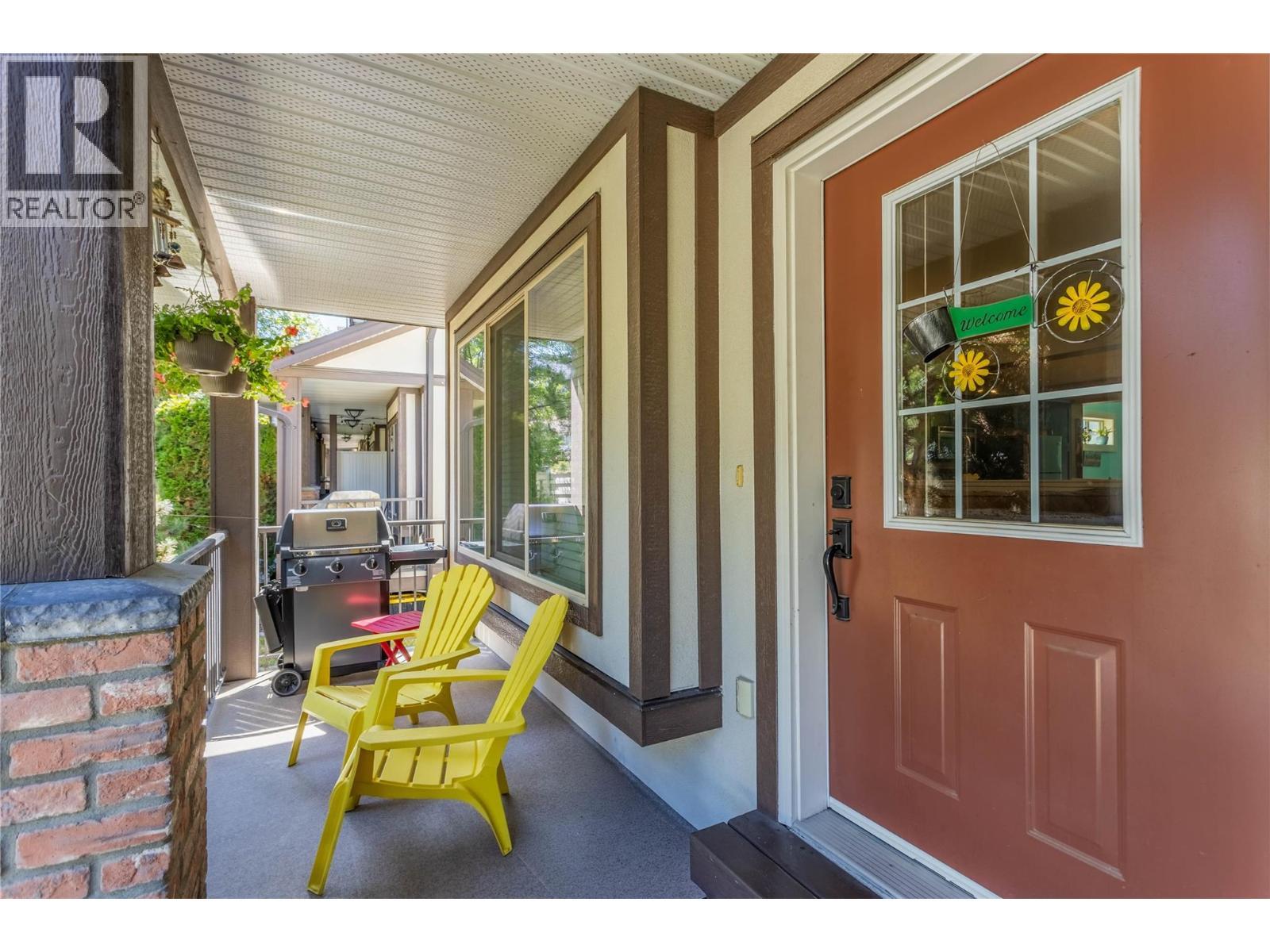 Front deck with room for enjoying morning coffee and a glass of wine in the evening. And of course, space for a bbq! - 128-1651 Lynrick Road, Kelowna, BC