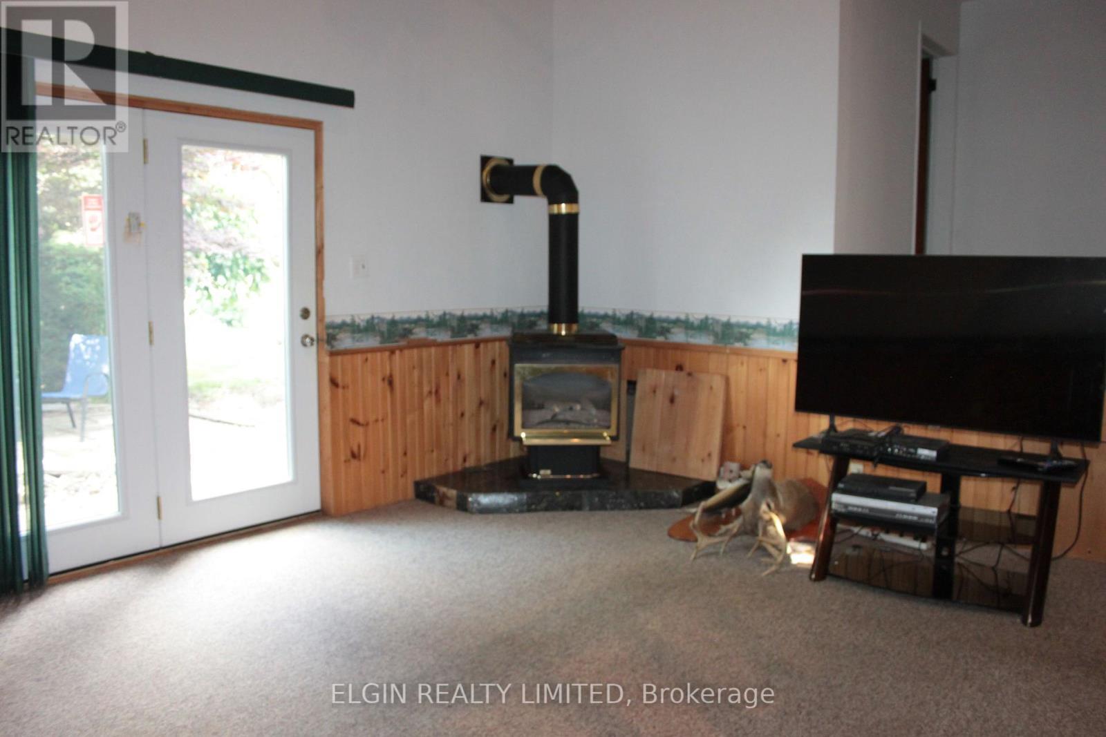 family room with gas fireplace - 44356 Talbot Line, Central Elgin, ON
