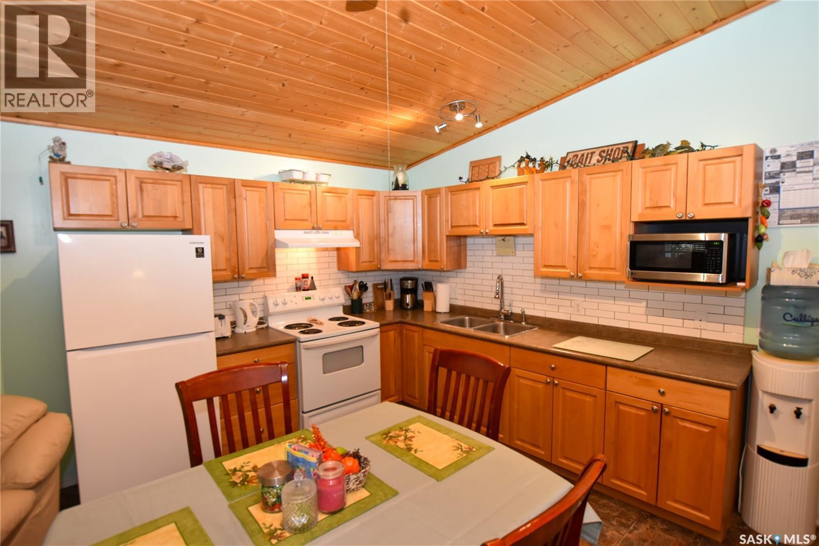 134 Sunridge Road, Pebble Baye, SK - Indoor Photo Showing Kitchen With Double Sink