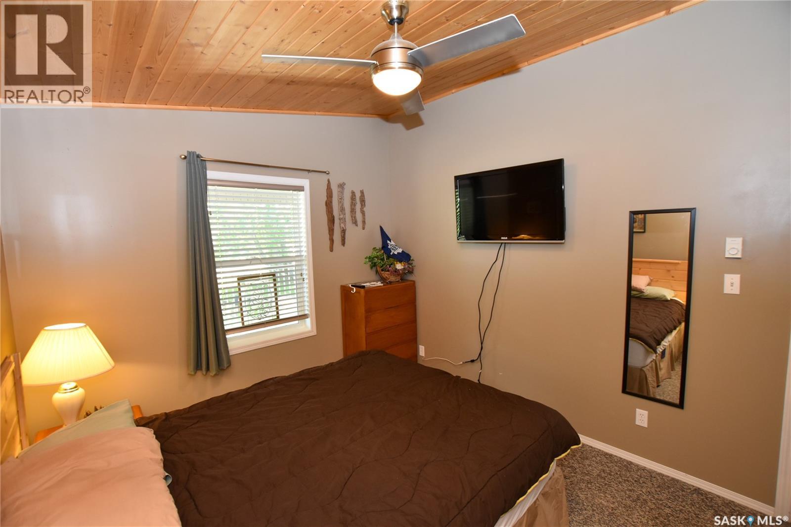 134 Sunridge Road, Pebble Baye, SK - Indoor Photo Showing Bedroom