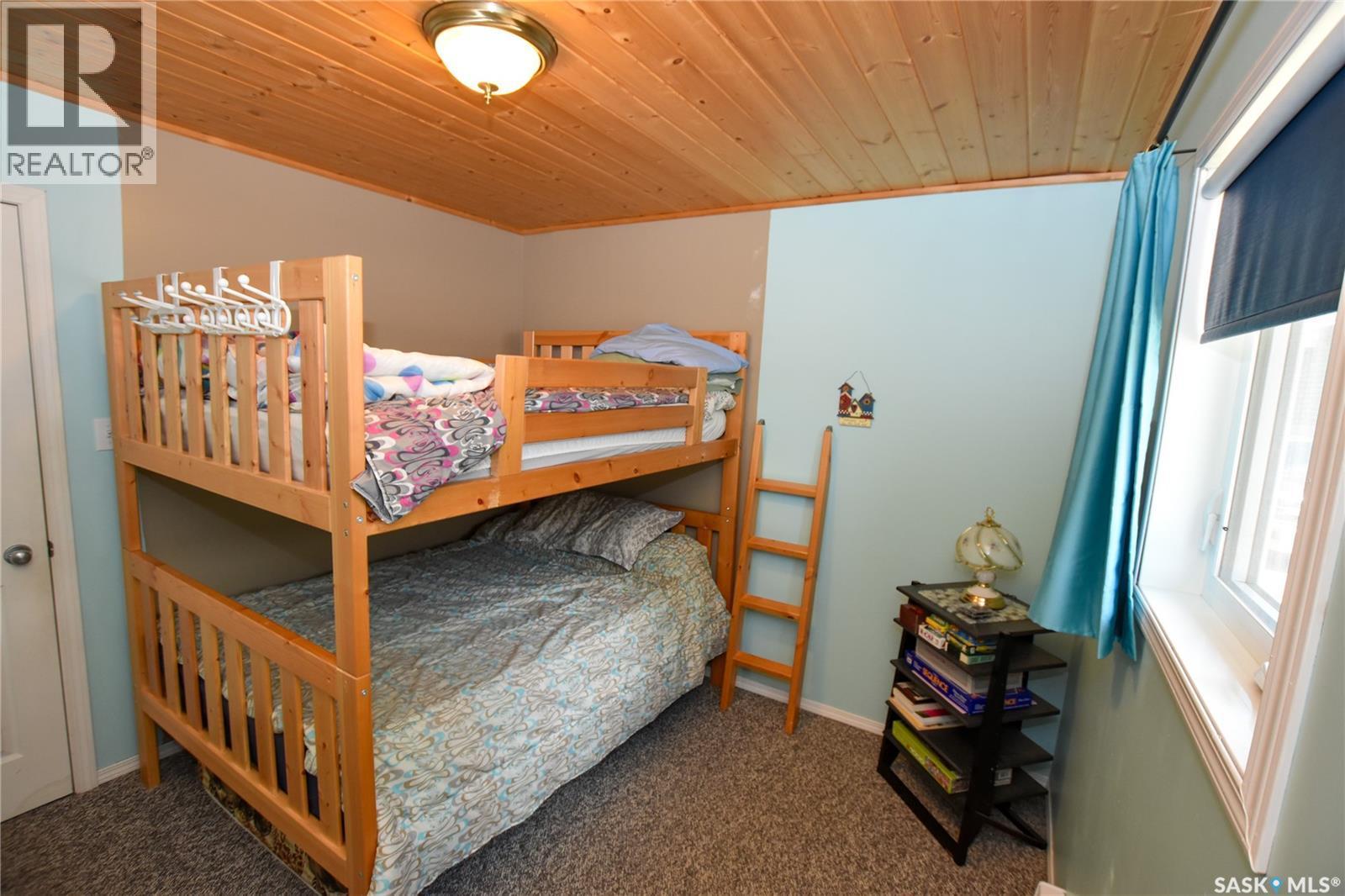 134 Sunridge Road, Pebble Baye, SK - Indoor Photo Showing Bedroom