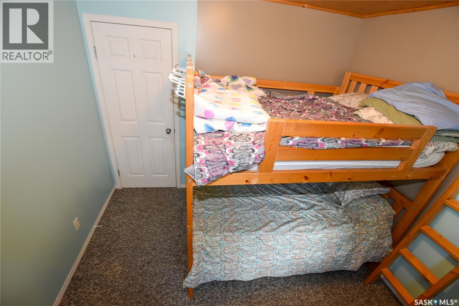 134 Sunridge Road, Pebble Baye, SK - Indoor Photo Showing Bedroom