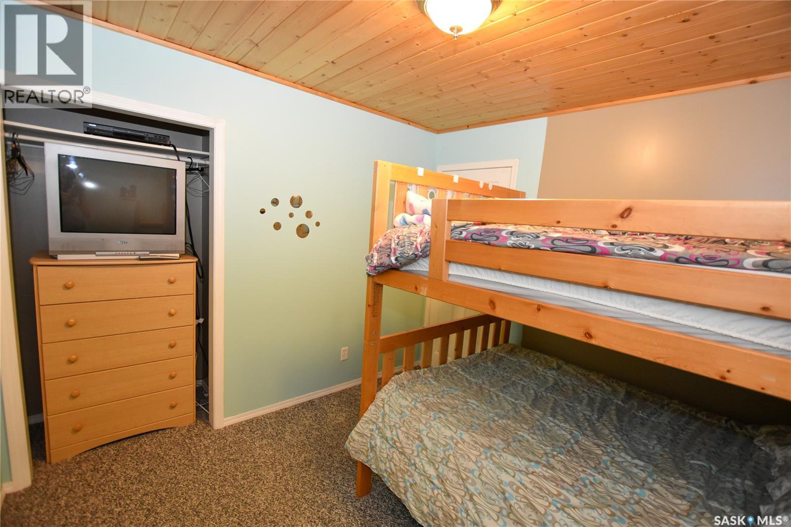 134 Sunridge Road, Pebble Baye, SK - Indoor Photo Showing Bedroom