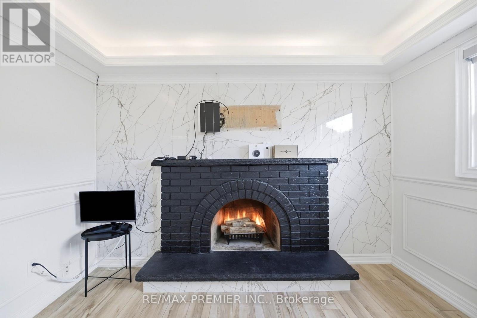 Ground & Lower - 21 Avon Crescent, Vaughan, ON - Indoor Photo Showing Living Room With Fireplace