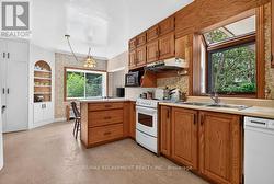 Spacious kitchen with window over the sink - 