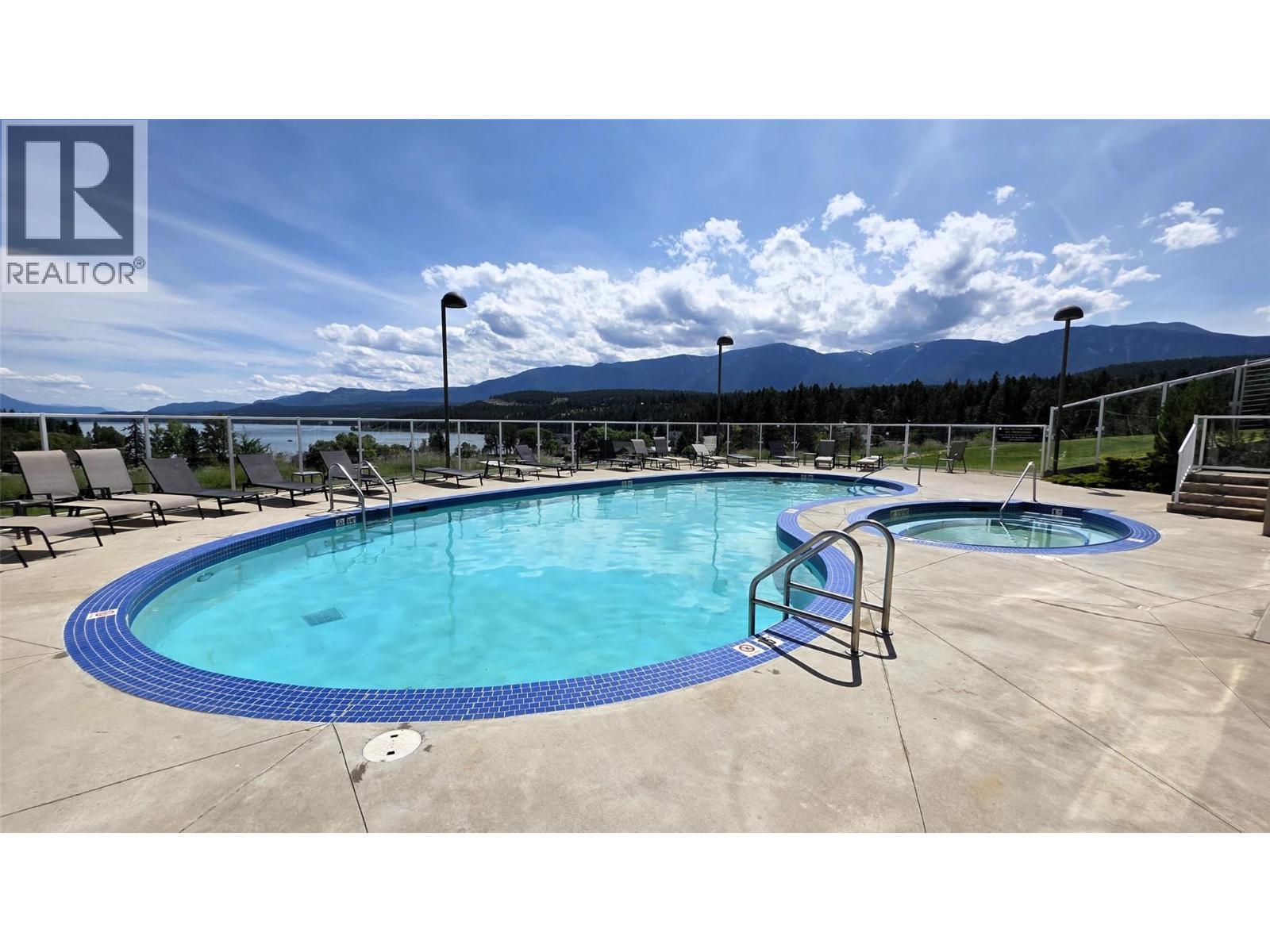 701 14A Crescent Unit# 213 I, Invermere, BC - Outdoor With In Ground Pool With Backyard