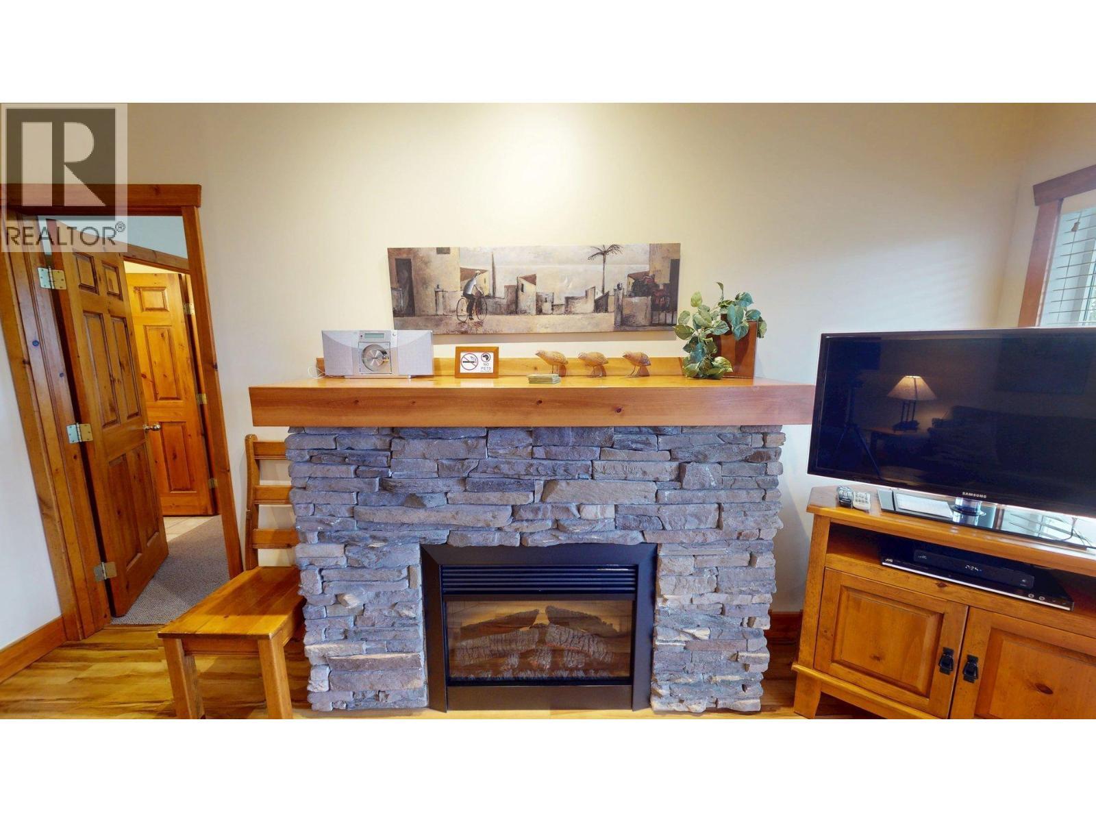 701 14A Crescent Unit# 213 I, Invermere, BC - Indoor With Fireplace