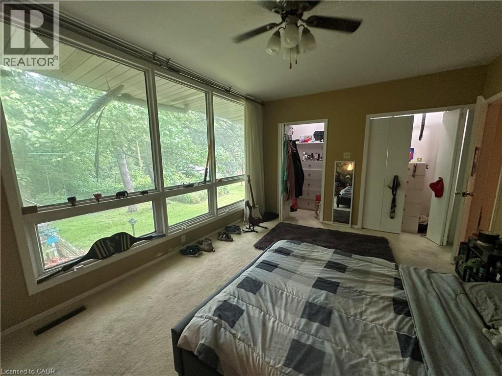 Room featuring expansive windows with exterior tree views - 11 Wilmont Court, Hamilton, ON