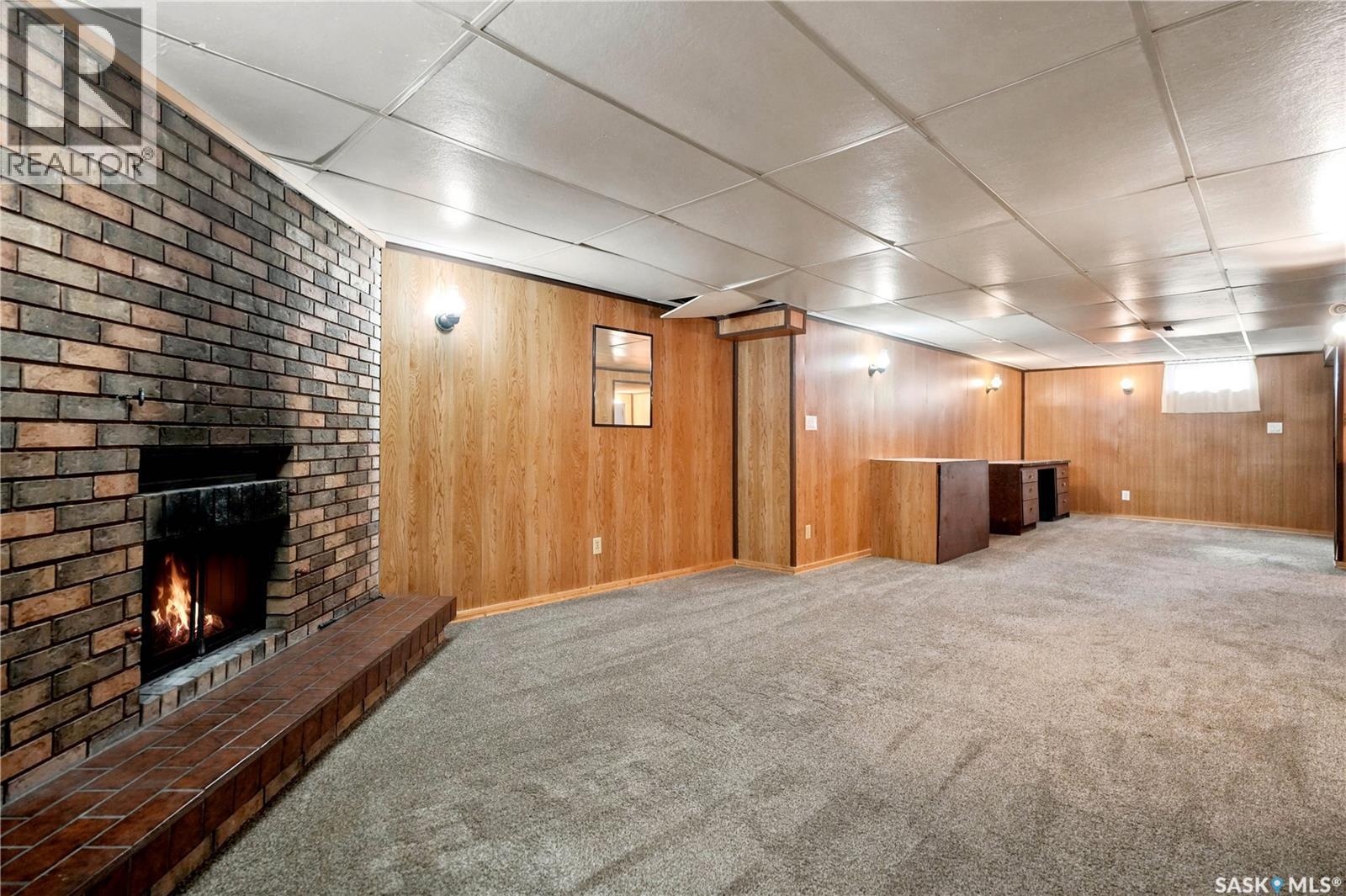 3326 4Th Avenue N, Regina, SK - Indoor Photo Showing Basement With Fireplace
