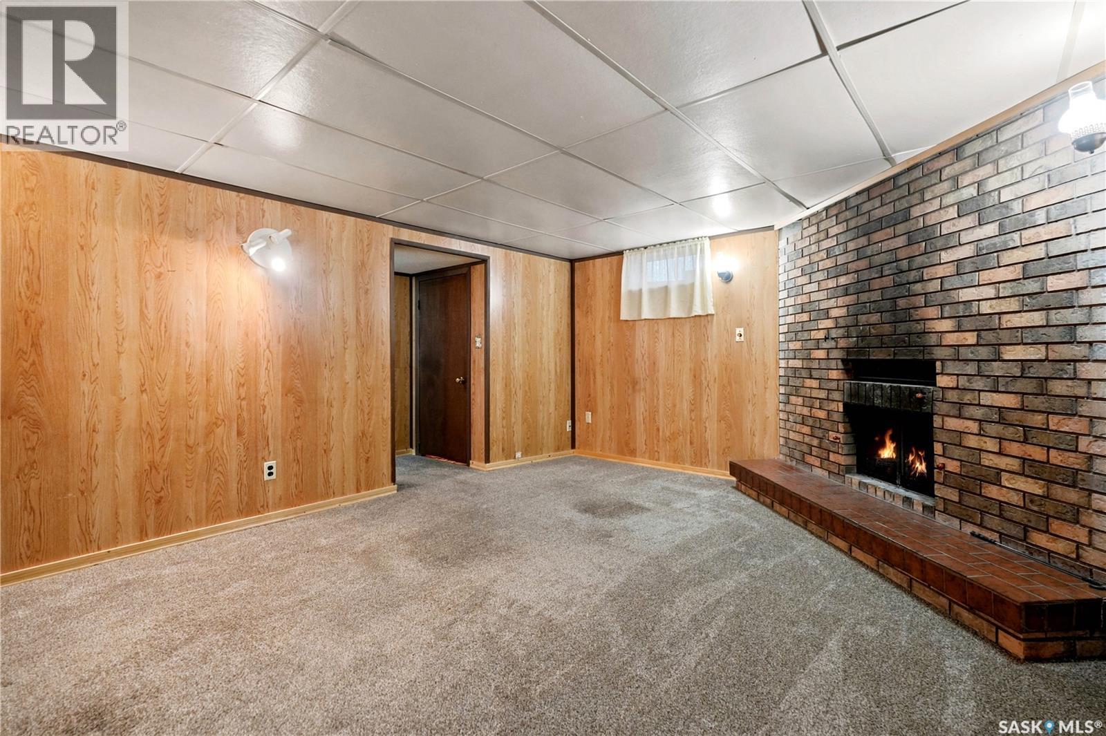3326 4Th Avenue N, Regina, SK - Indoor Photo Showing Other Room With Fireplace