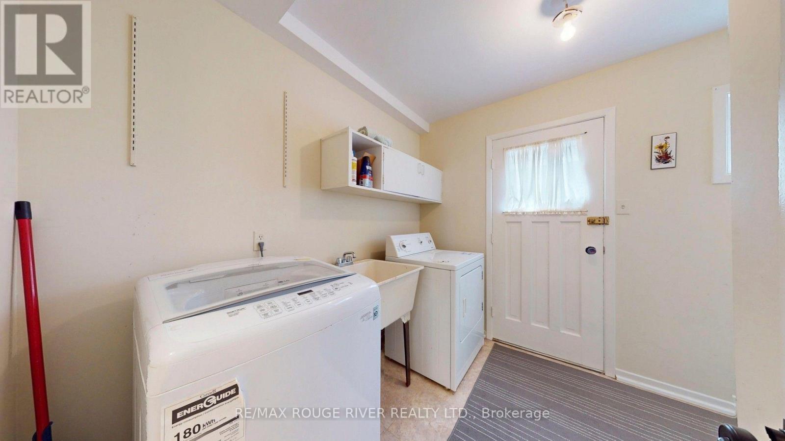 Laundry With Side Door - 33 Pepper Tree Drive, Toronto, ON - Indoor Photo Showing Laundry Room