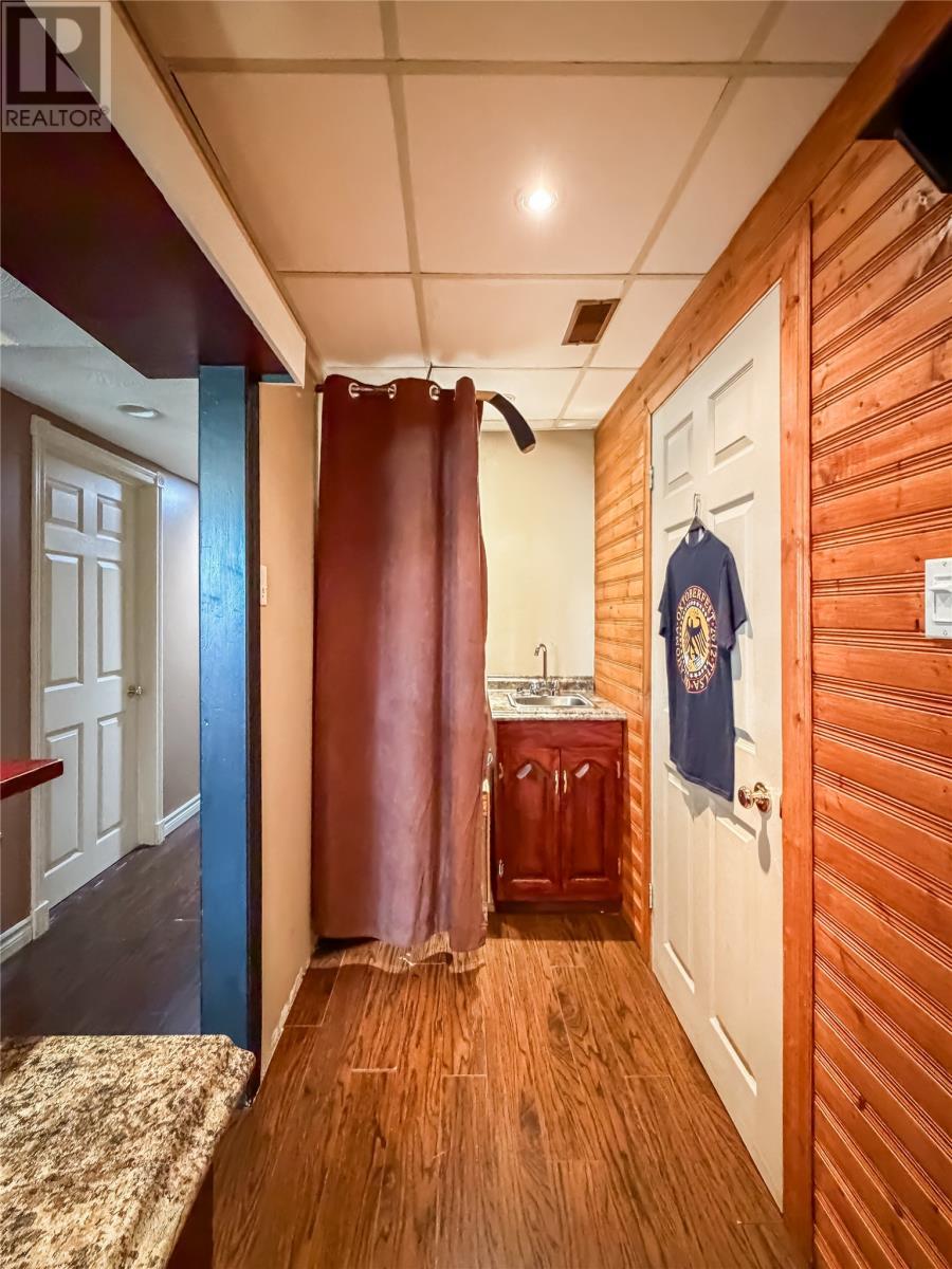 Basement recreation room with a wet bar - 100A Main Road, Lewin'S Cove, NL