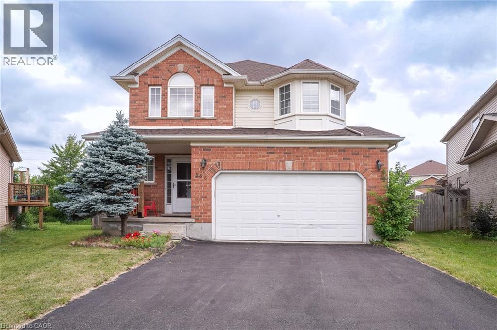 Two-story residence featuring a brick and siding exterior, an attached two-car garage, and a paved driveway - 566 Avignon Place, Waterloo, ON
