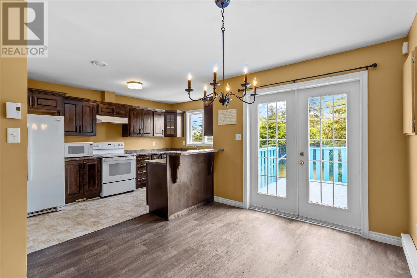 Dining Room + Kitchen with Double Opening Doors to Patio - 7 Penney Crescent, St John'S, NL
