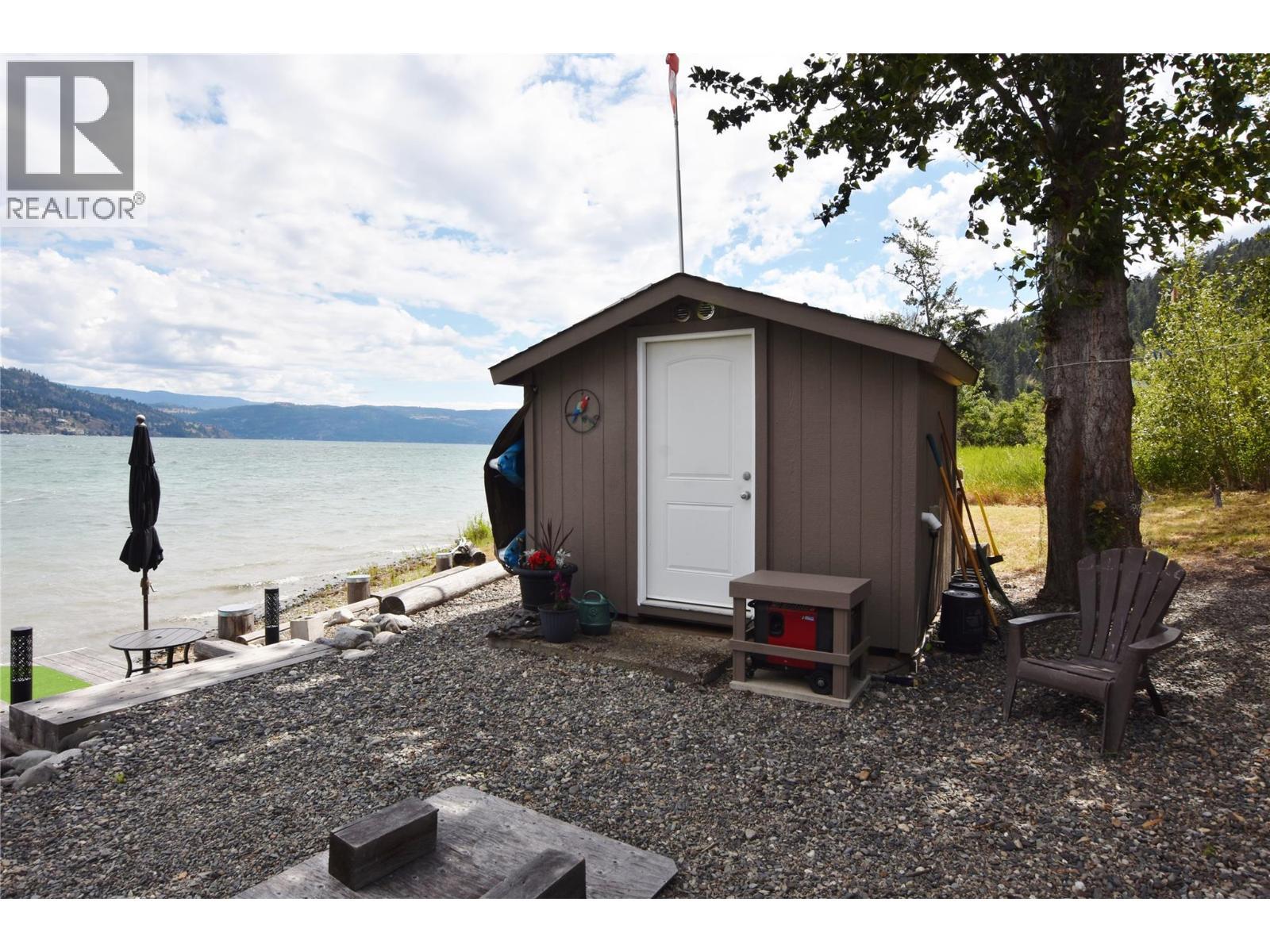 beach shed with solar batteries - 1 Imtil Road, Vernon, BC - Outdoor With Body Of Water