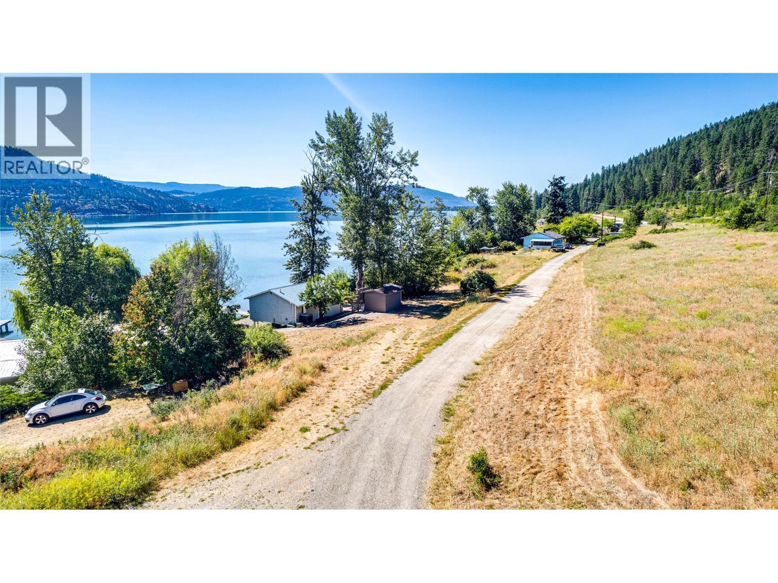 Driveway - 1 Imtil Road, Vernon, BC - Outdoor With Body Of Water With View