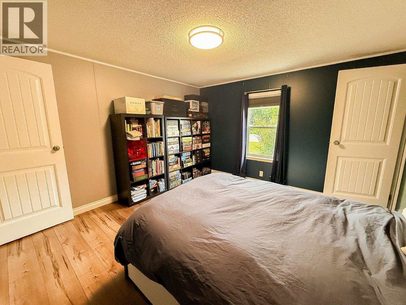 9805 E 98 Avenue, Taylor, BC - Indoor Photo Showing Bedroom