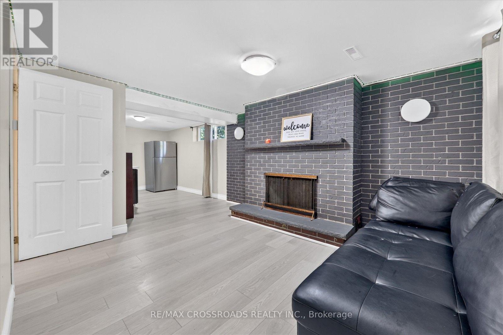 10 Gillbank Crescent S, Toronto, ON - Indoor Photo Showing Living Room With Fireplace