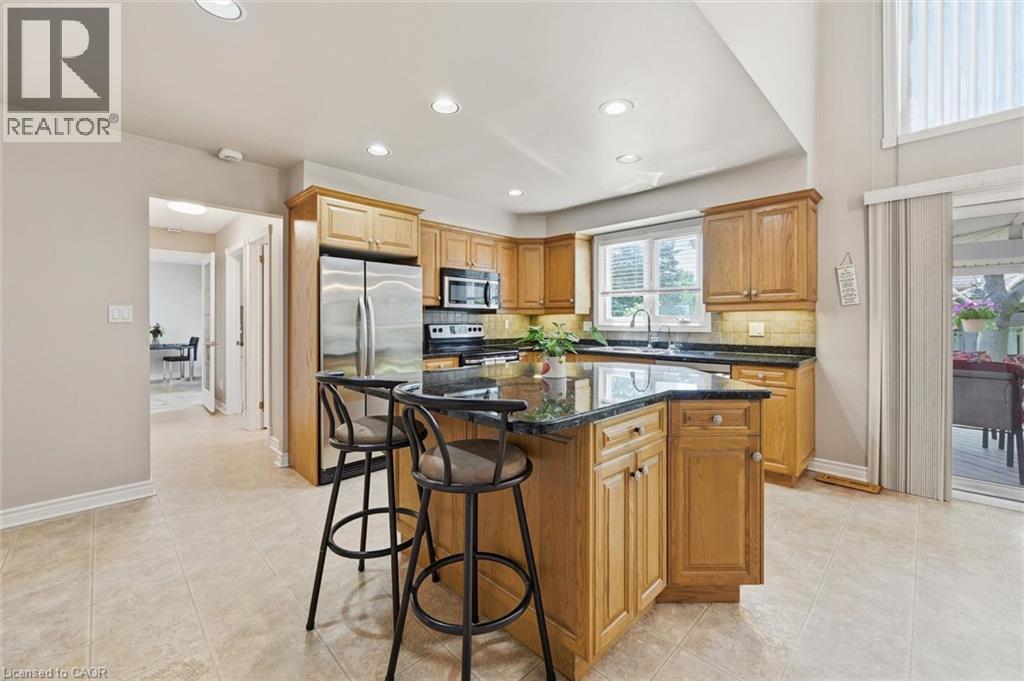 Primary Kitchen, bright, spacious, with deck access - 1 Idared Road, Carlisle, ON - Indoor Photo Showing Kitchen
