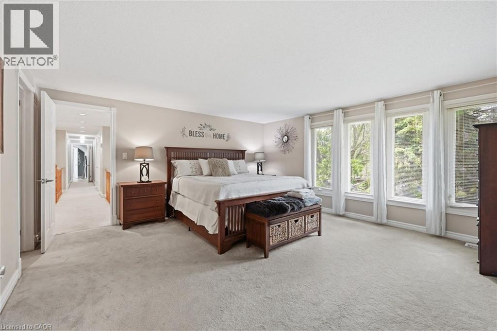 Primary Bedroom with ample natural light, huge walk-in-closet, and gorgeous ensuite washroom - 1 Idared Road, Carlisle, ON - Indoor Photo Showing Bedroom