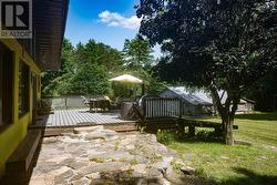 Large deck off eat in kitchen & stone patio -