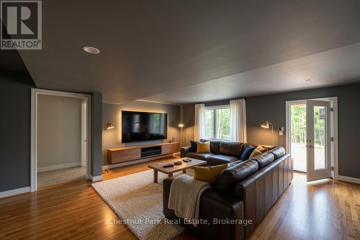AI concept of basement walk out tv room - 23 Maple Ridge Road, Nipissing, ON - Indoor Photo Showing Living Room