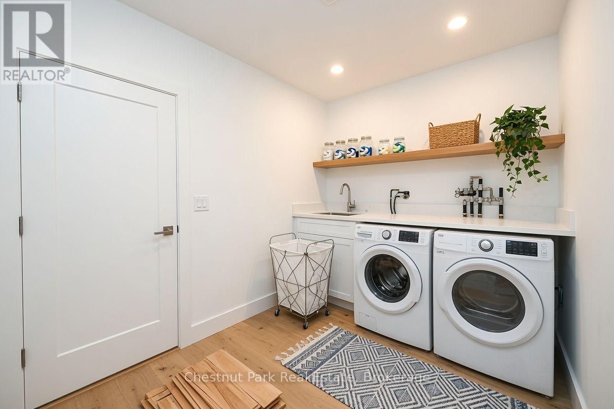 AI concept of laundry room - 23 Maple Ridge Road, Nipissing, ON - Indoor Photo Showing Laundry Room