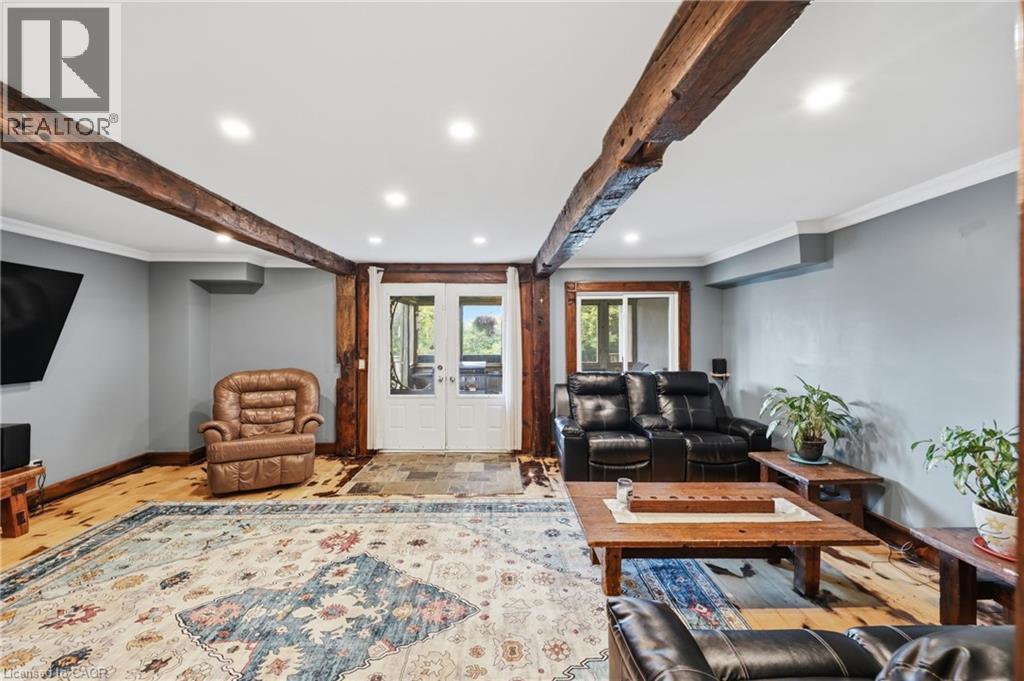 Exposed wood beams accenting the ceiling and wall supports - 97 Smith Road, Hamilton, ON
