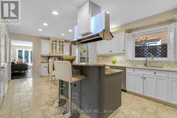 Kitchen w/ Tiered Central Island -
