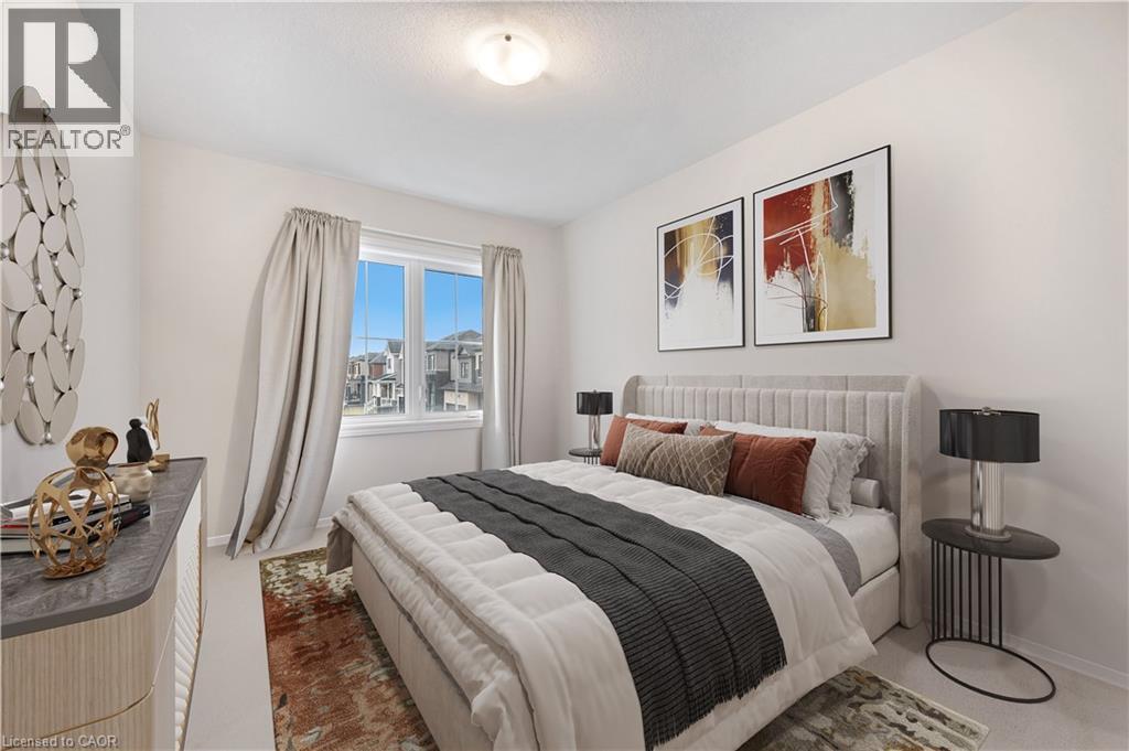 Bright room featuring a window with exterior views, light-colored walls, and a ceiling-mounted light fixture - 61 Vanilla Trail, Thorold, ON