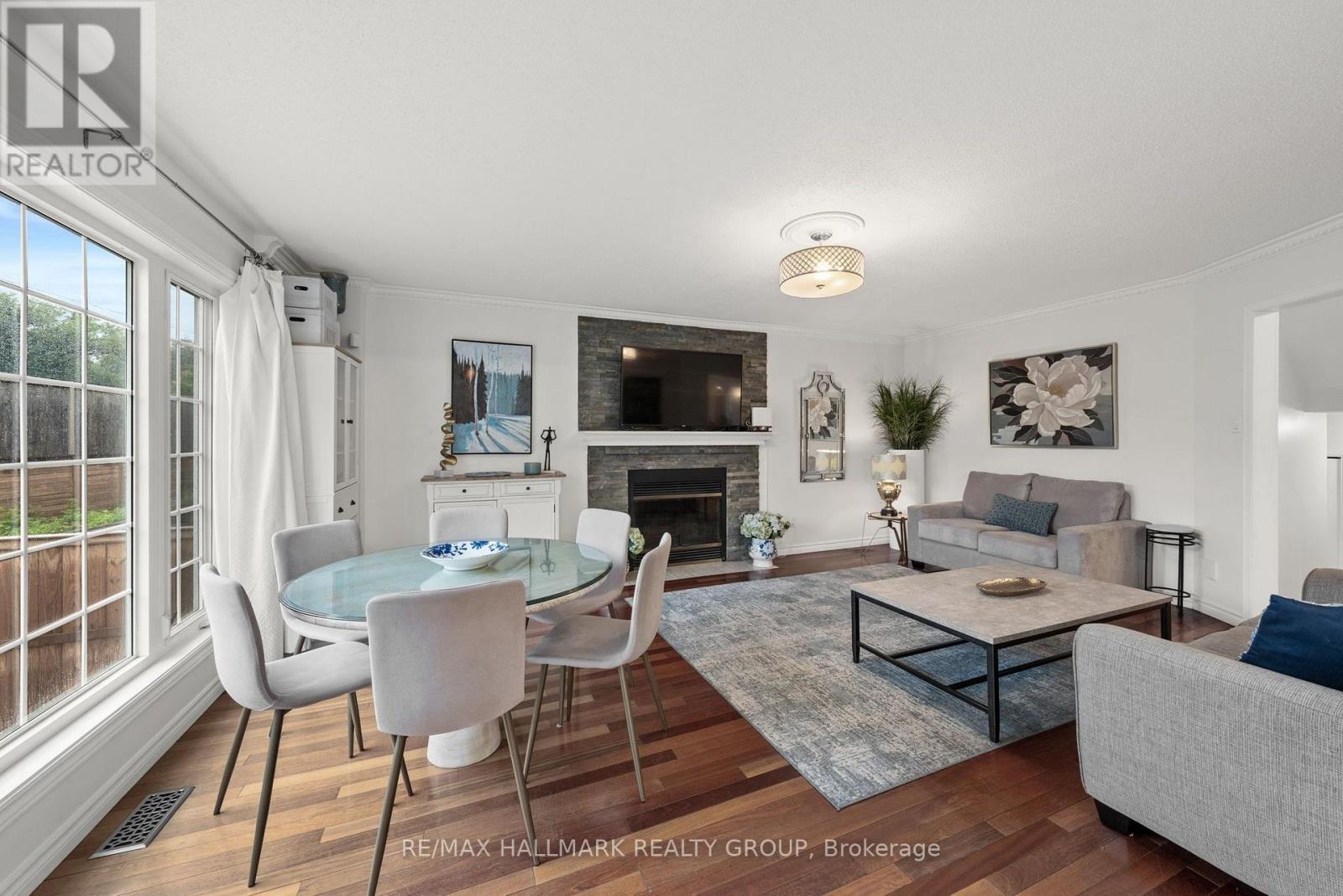 Family room with wood fireplace - 29 Depper Place, Ottawa, ON