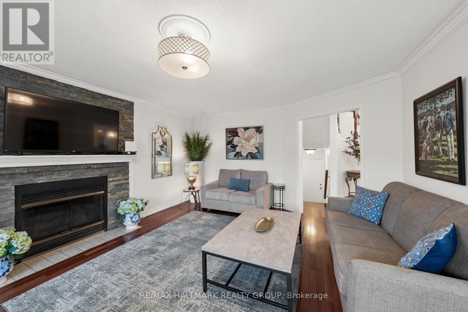 Family room with wood fireplace - 29 Depper Place, Ottawa, ON