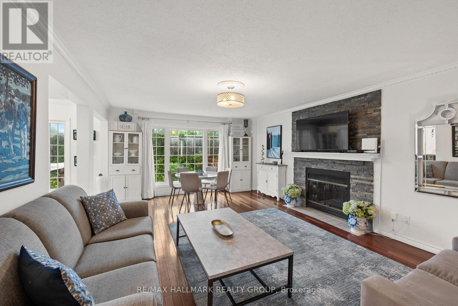Family room with wood fireplace - 29 Depper Place, Ottawa, ON