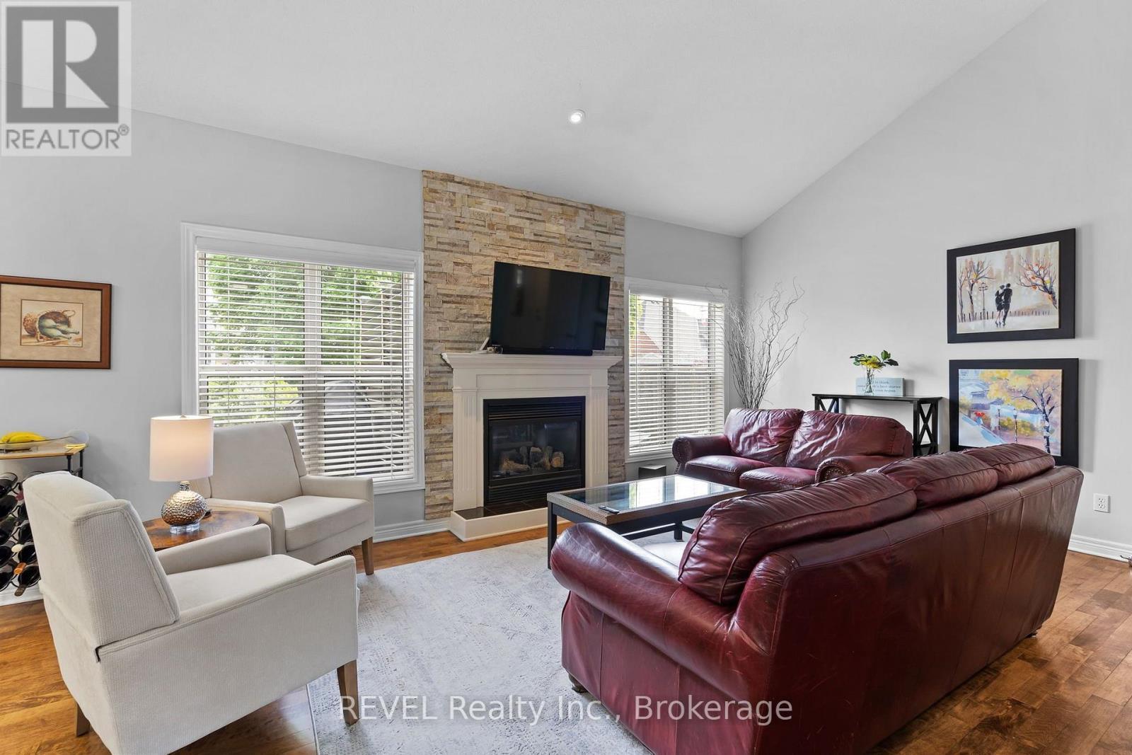 16 Maracay Way, St. Catharines (Grapeview), ON - Indoor Photo Showing Living Room With Fireplace