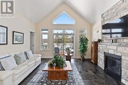 Living room w/ walkout to lakeside dec -
