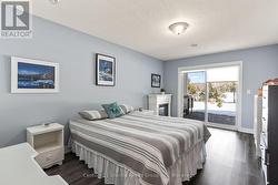 Second bedroom w/ walkout to lakeside patio -