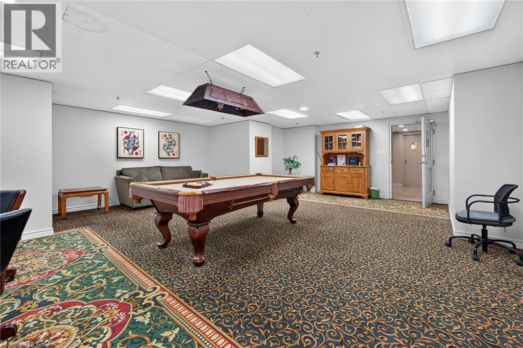 Recreational space featuring a billiards table with an overhead light fixture, recessed lighting, and patterned carpet flooring - 1237 North Shore Boulevard Unit# 405, Burlington, ON - Indoor Photo Showing Other Room