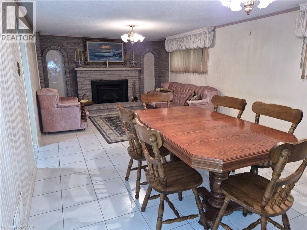 11 Fassett Avenue, Hamilton, ON - Indoor Photo Showing Dining Room With Fireplace