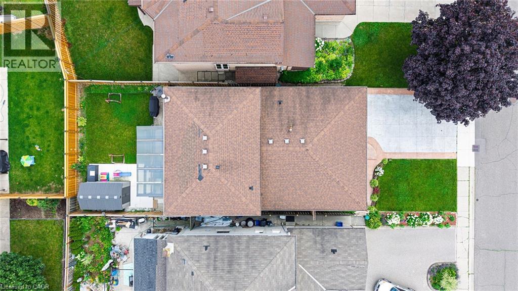 Residential property featuring a shingle roof and a paved driveway - 214 Merrilee Crescent, Hamilton, ON