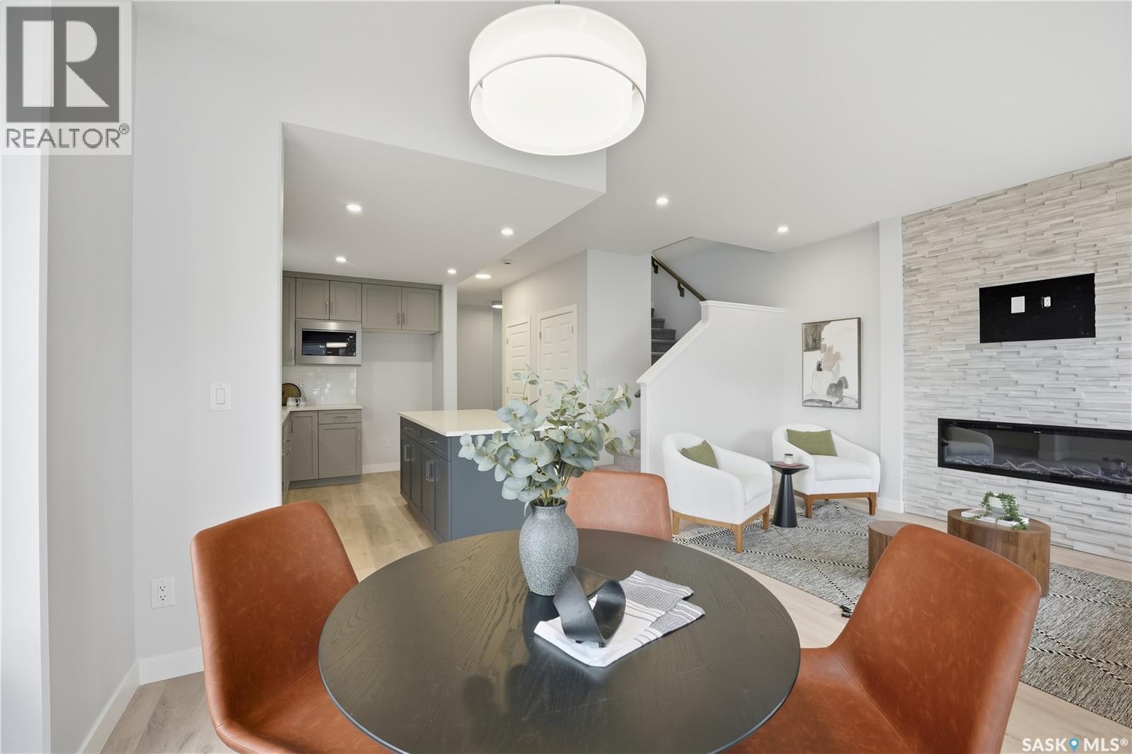 266 Kostiuk Crescent, Saskatoon, SK - Indoor Photo Showing Dining Room With Fireplace