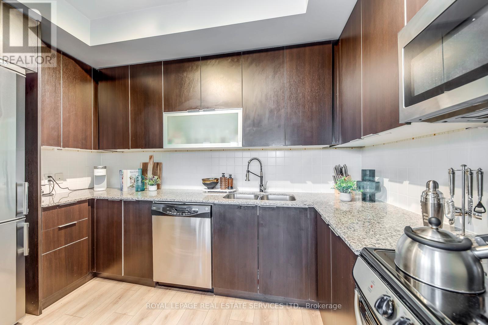 203 - 16 Brookers Lane, Toronto, ON - Indoor Photo Showing Kitchen With Double Sink With Upgraded Kitchen