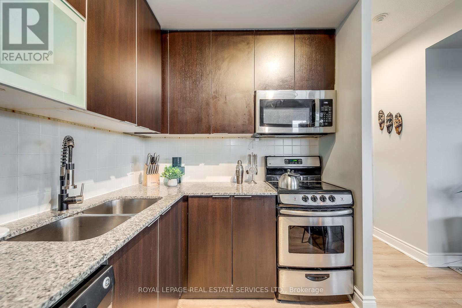 203 - 16 Brookers Lane, Toronto, ON - Indoor Photo Showing Kitchen With Double Sink