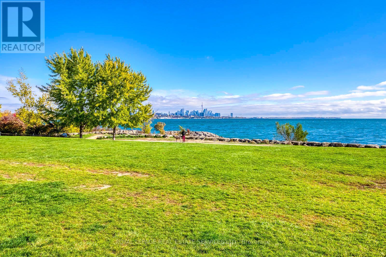 Area Down the Buidling - 203 - 16 Brookers Lane, Toronto, ON - Outdoor With Body Of Water With View