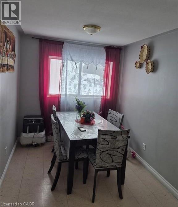 Well-lit interior space featuring pale gray walls, light-toned flooring, and a flush mount ceiling light fixture - 76 Brybeck Crescent Unit# 302, Kitchener, ON
