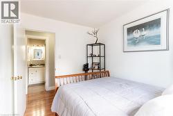 Room featuring wood-finish flooring and light-toned walls - 
