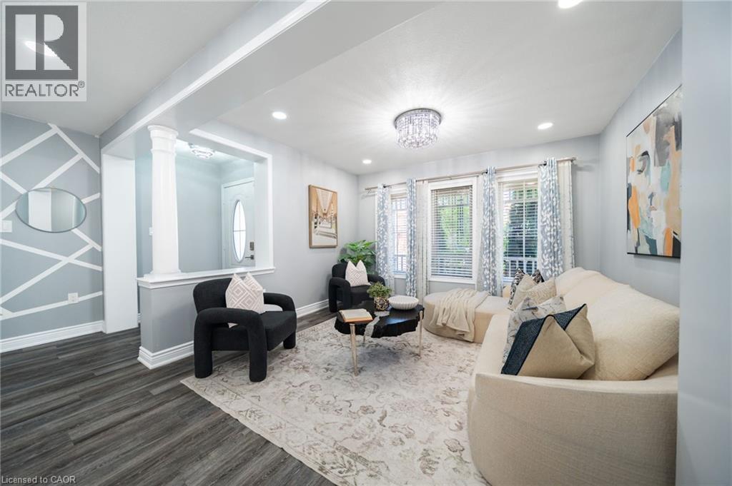 Living area featuring wood-finish flooring, recessed lighting, and a decorative chandelier - 151 Baldwin Drive, Cambridge, ON - Indoor